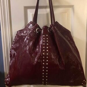 Gorgeous Burgundy Michael Kors patent leather hobo/tote bag